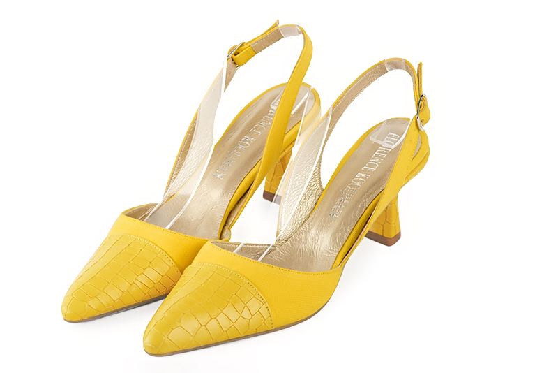 Yellow women's slingback shoes. Tapered toe. Medium spool heels. Front view - Florence KOOIJMAN